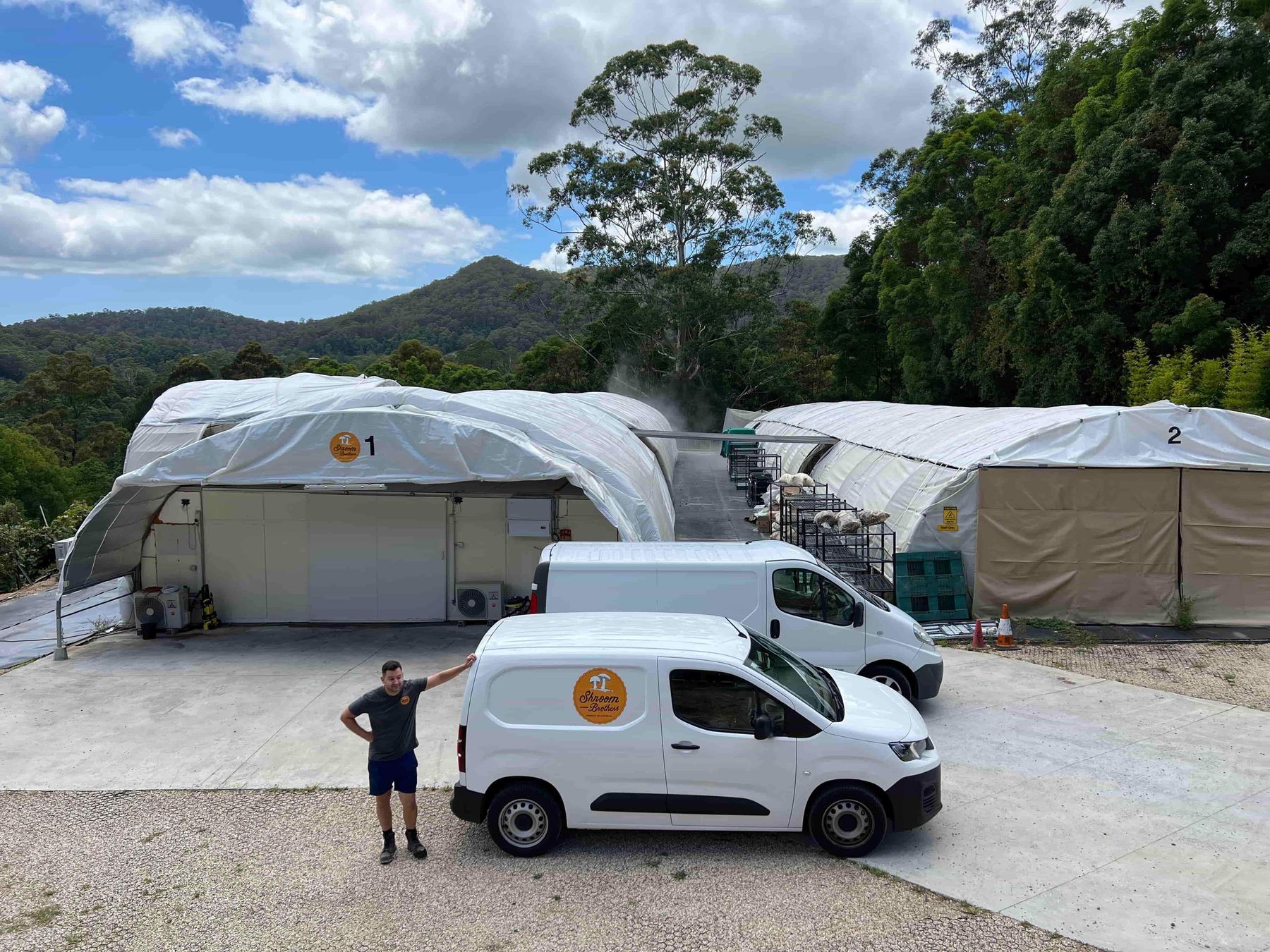 Shroom Brothers grow houses and delivery vans at the farm